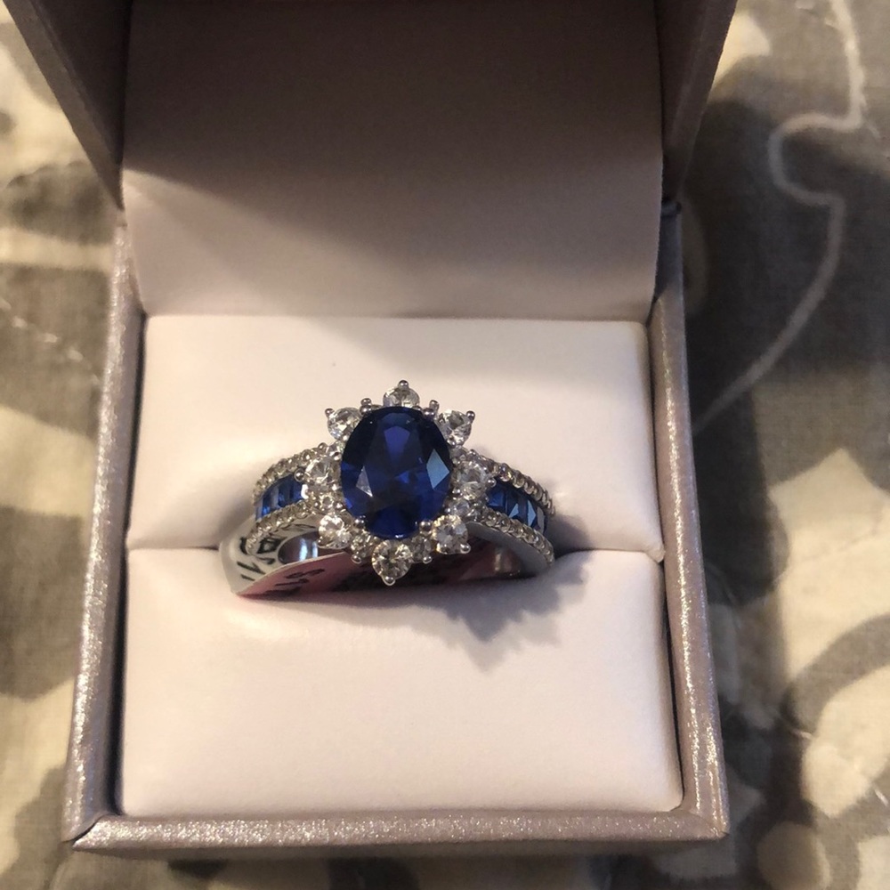 Blue and white sapphire oval halo